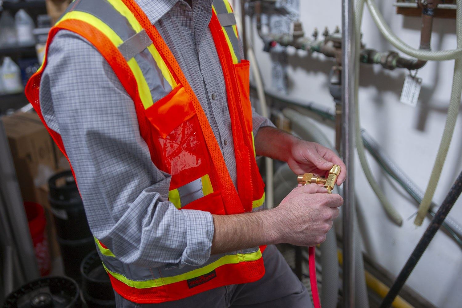 Technician repairing a backflow assembly