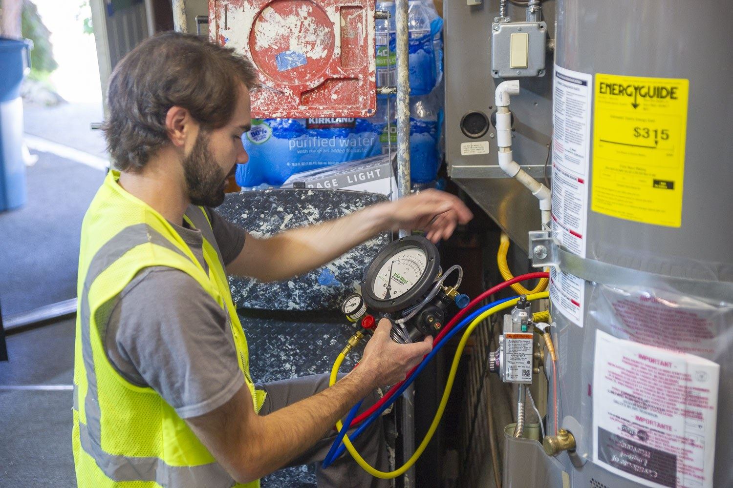 Technician reading a test gauge